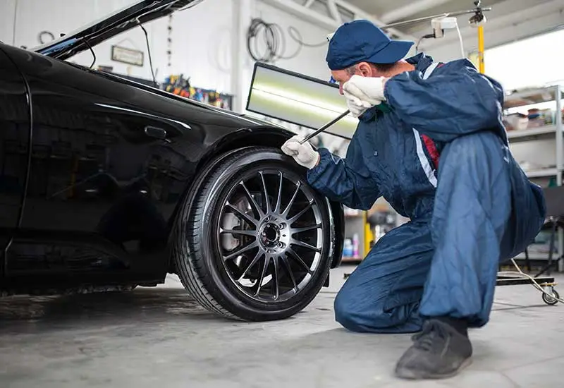 Paintless Dent Repair technician working